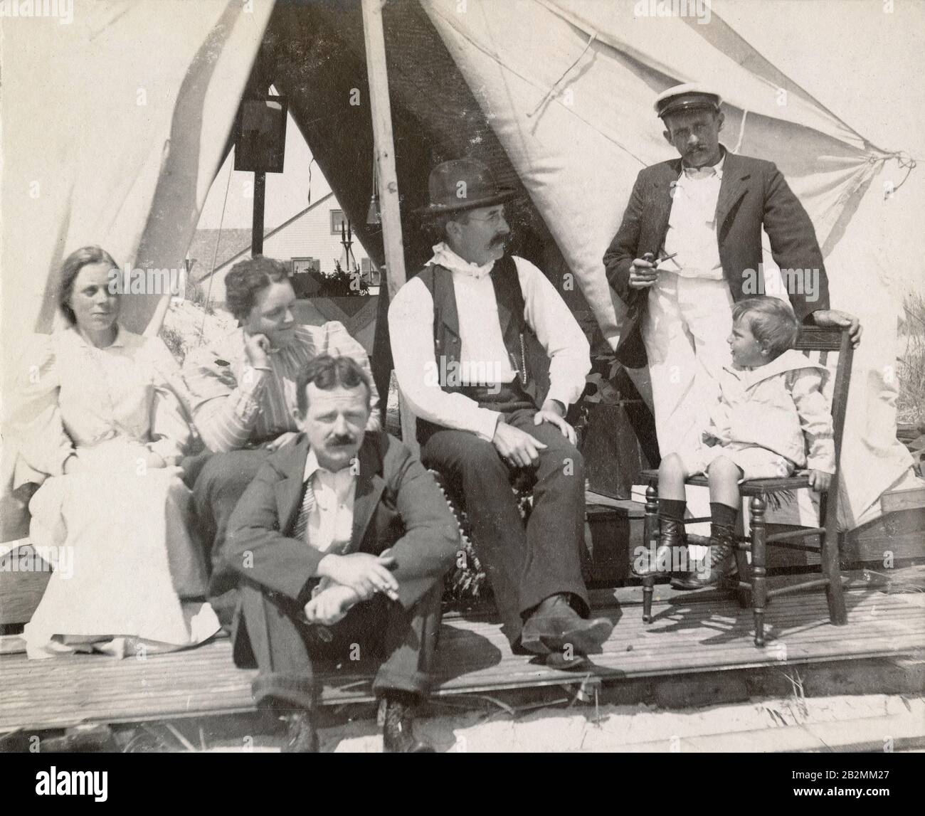 Antique 1898 photograph, family at their Victorian beach tent at Long Beach, New York. SOURCE: ORIGINAL PHOTOGRAPH Stock Photo