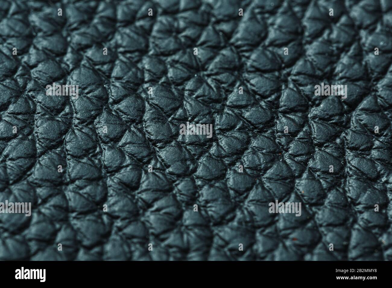 Green textured leather closeup. Full frame, close up. Macro Stock Photo