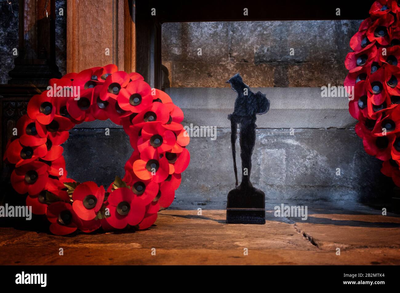 Poppy Wreath and soldier silhouette part of a Remembrance Sunday display Stock Photo