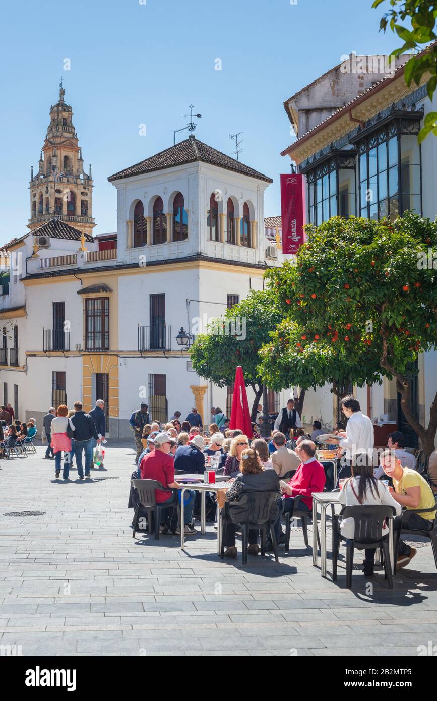 In view of the Bell Tower of the Mezquita a street cafe in Plaza Agrupación de Cofradías in Córdoba, Andalusia, Spain Stock Photo