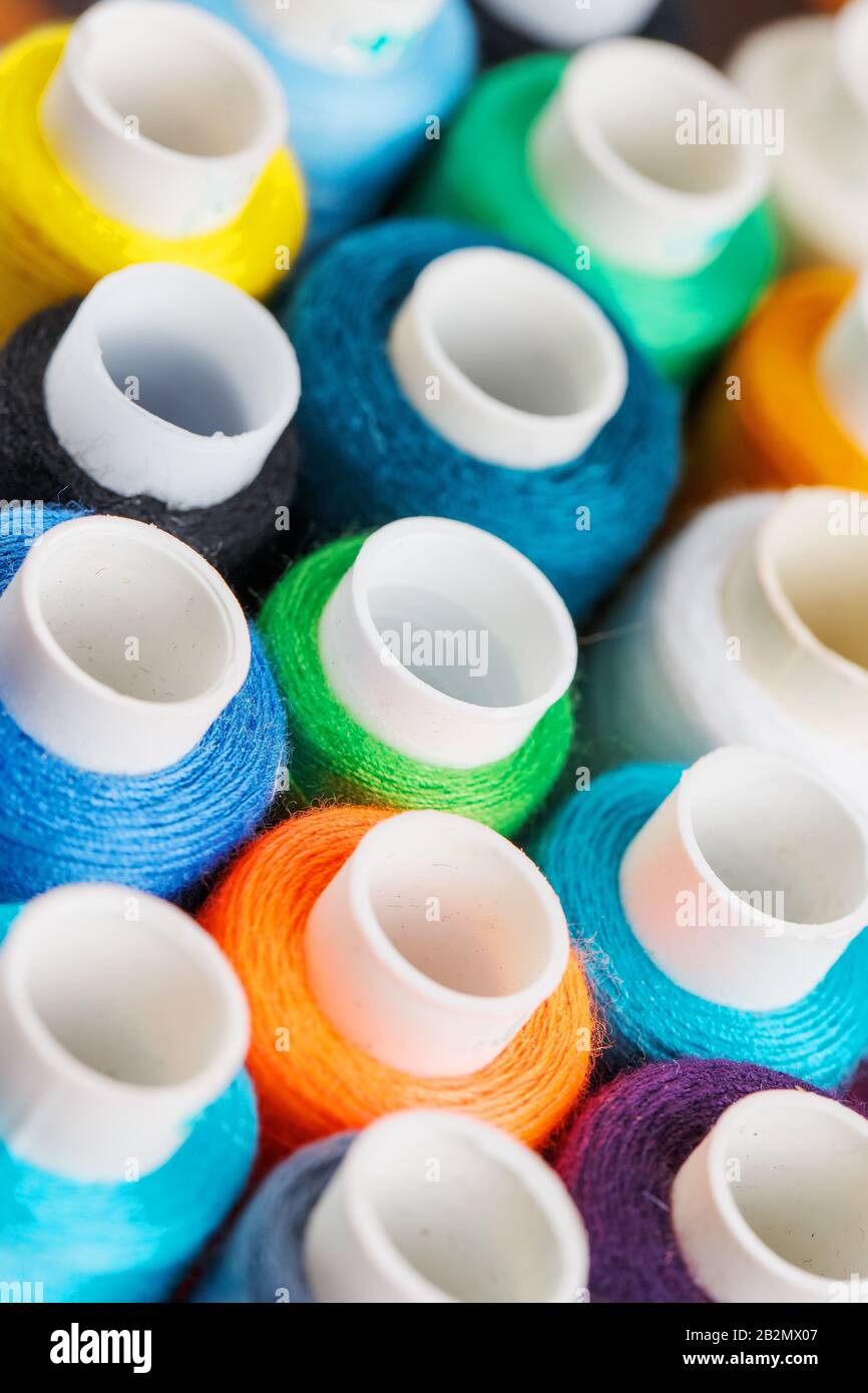 Colorful spools of sewing thread. Colored thread for sewing. Texture ...
