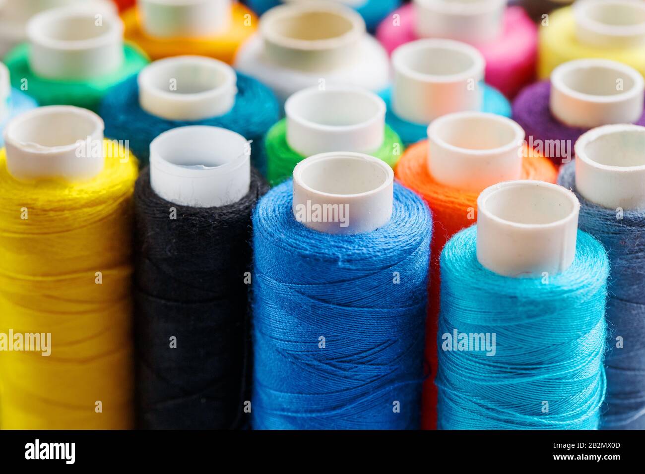 Colorful spools of sewing thread. Colored thread for sewing. Texture ...