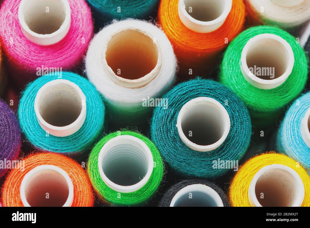 Colorful spools of sewing thread. Colored thread for sewing. Texture ...