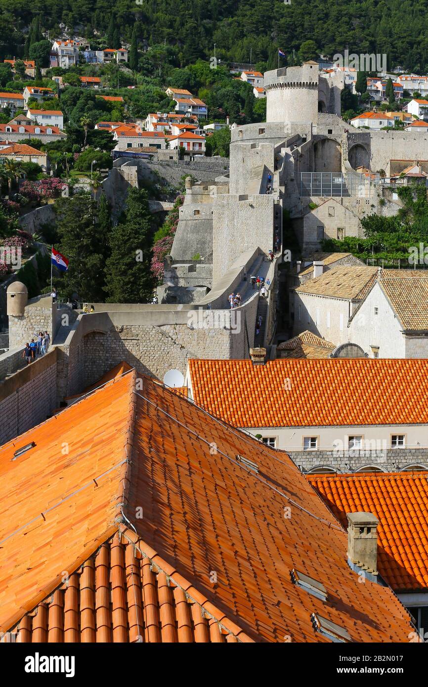 People climbing the medieval city walls up towards the Minceta Tower, Dubrovnik, Croatia Stock Photo