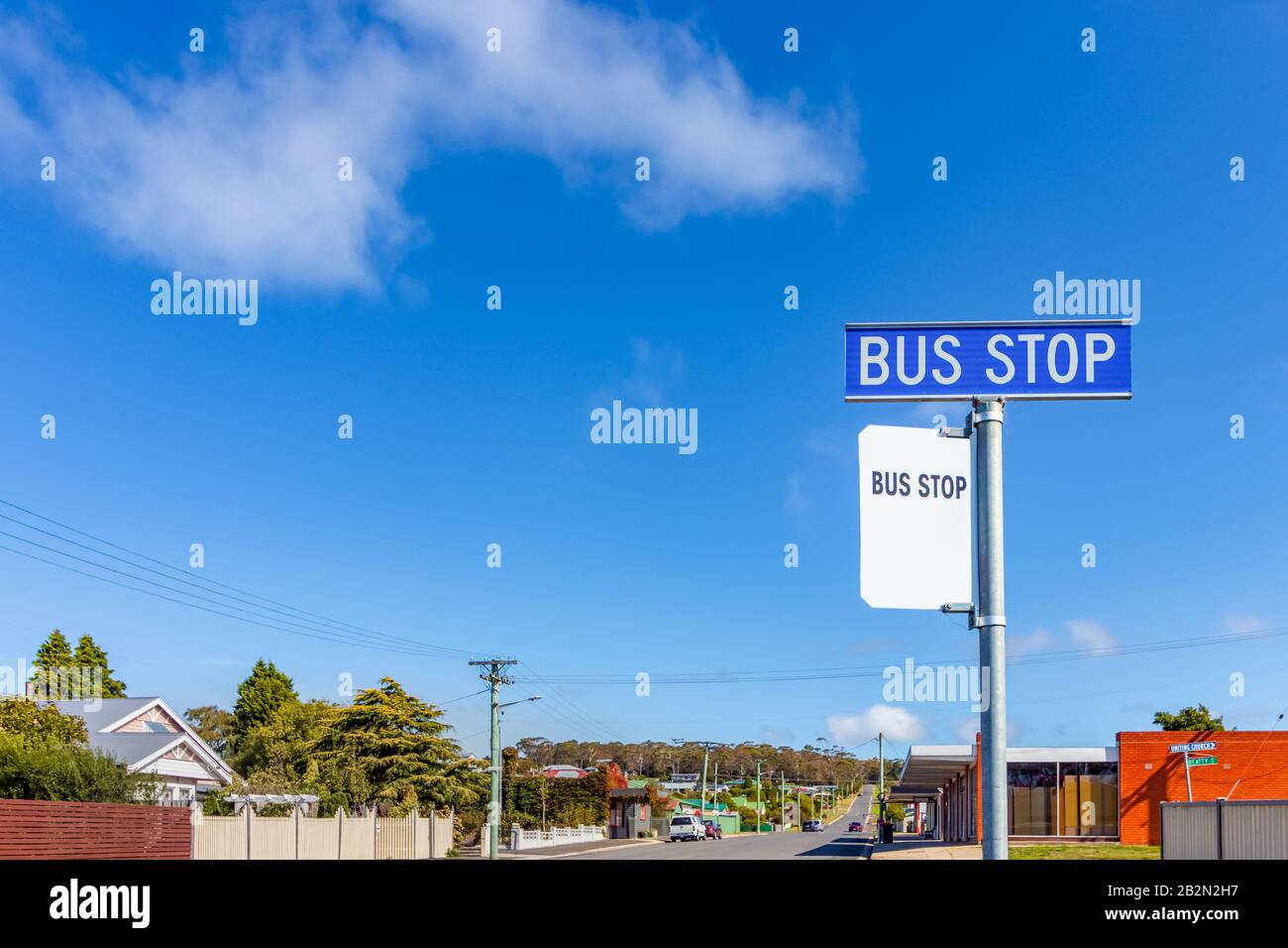 A blue bus stop sign on a side road in Bell Bay, Tasmania, Australia. Stock Photo