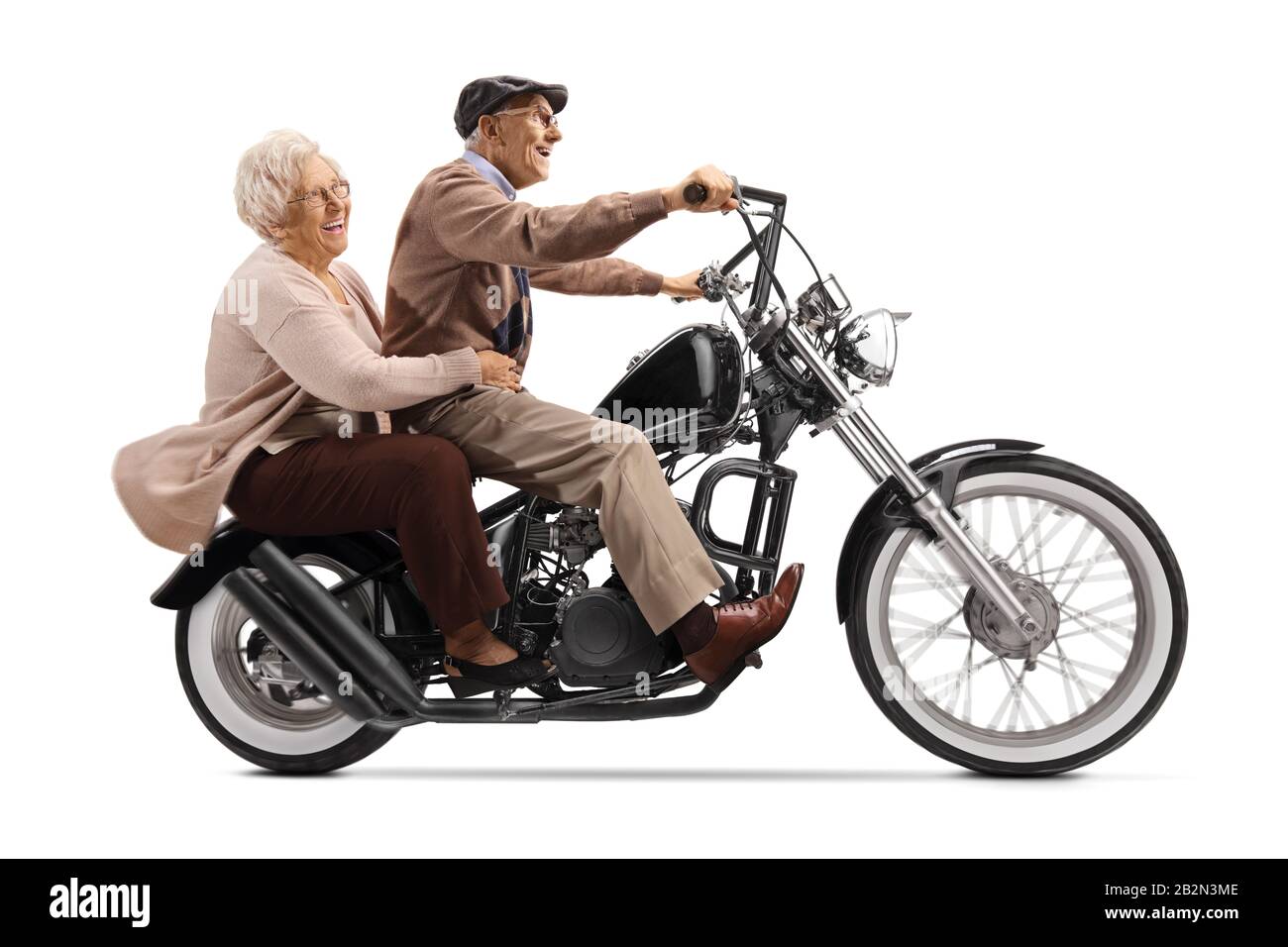 Senior man and woman riding on a custom motorbike isolated on white background Stock Photo