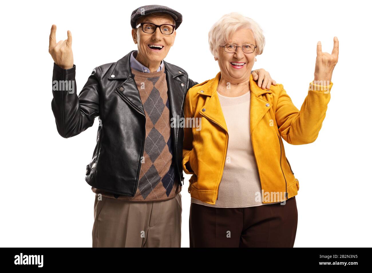 Senior man and woman with leather jackets gesturing a rock and roll sign isolated on white background Stock Photo