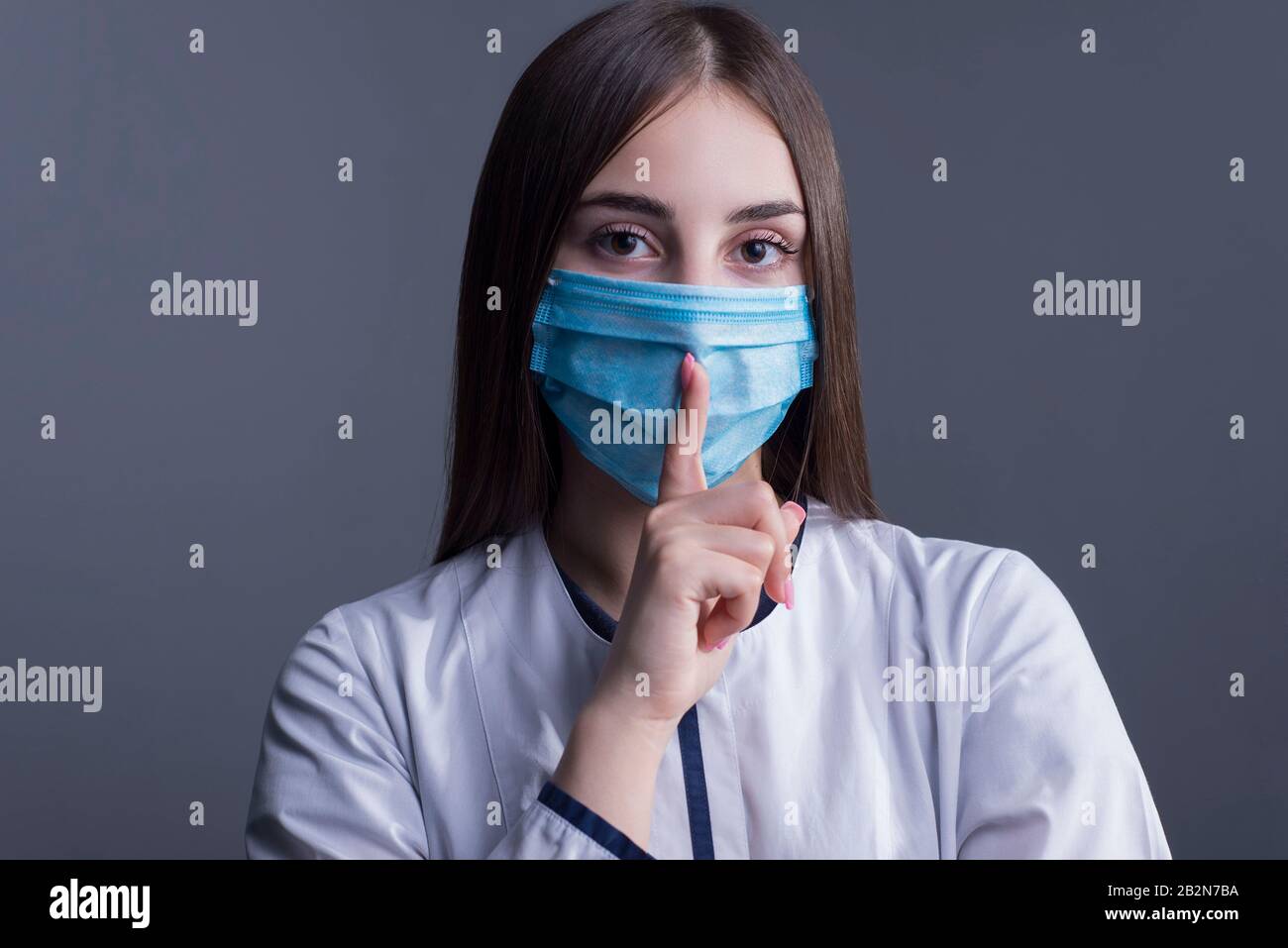Closeup portrait of a young girl. doctor in a white coat, and a medical ...