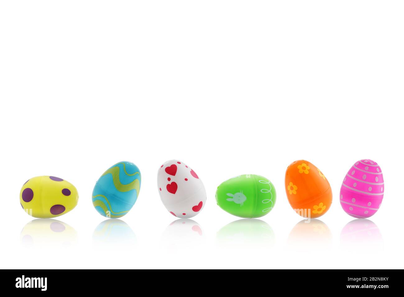 A set of Easter toy eggs on white with reflection Stock Photo