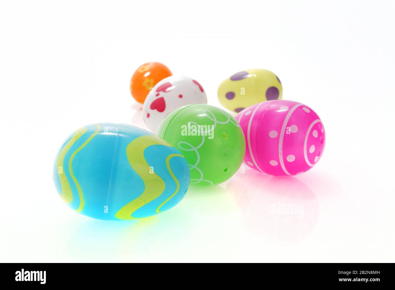 A set of colorful Easter egg toys on white with selective focus and shallow depth of field Stock Photo