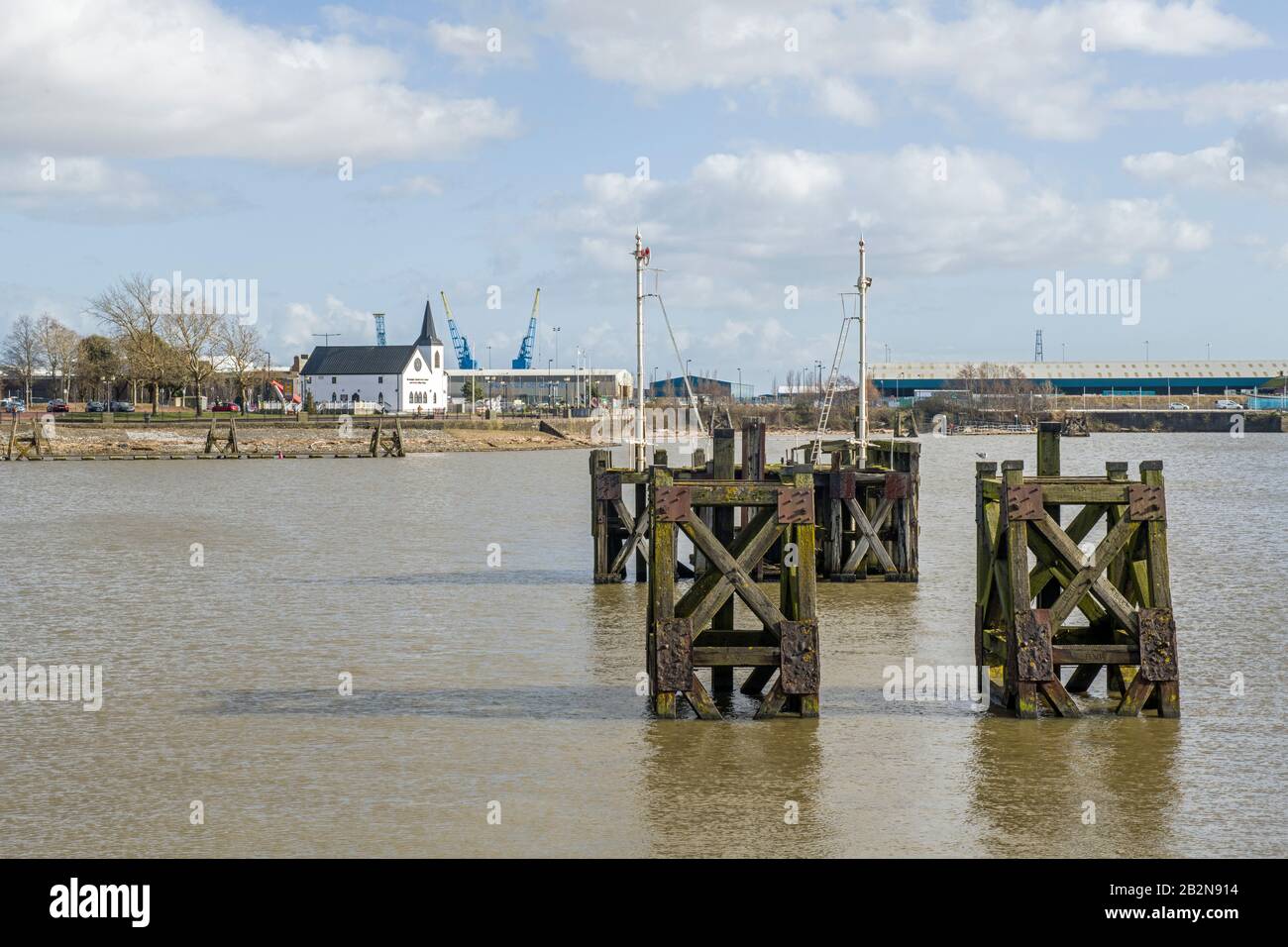 Wooden structures in the Bay known as Dolphins, used to moor ships to when carrying out repair work. They have been left here as a reminder. Stock Photo