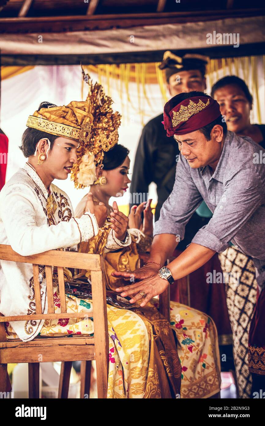 BALI, INDONESIA - APRIL 13, 2018: Newlyweds on balinese wedding ceremony. Traditional wedding Bali Stock Photo