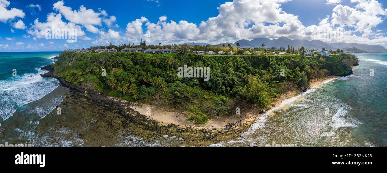 Aerial panoramic image off the coast over Princeville and the Kenomene Ocean Sunset Overlook on