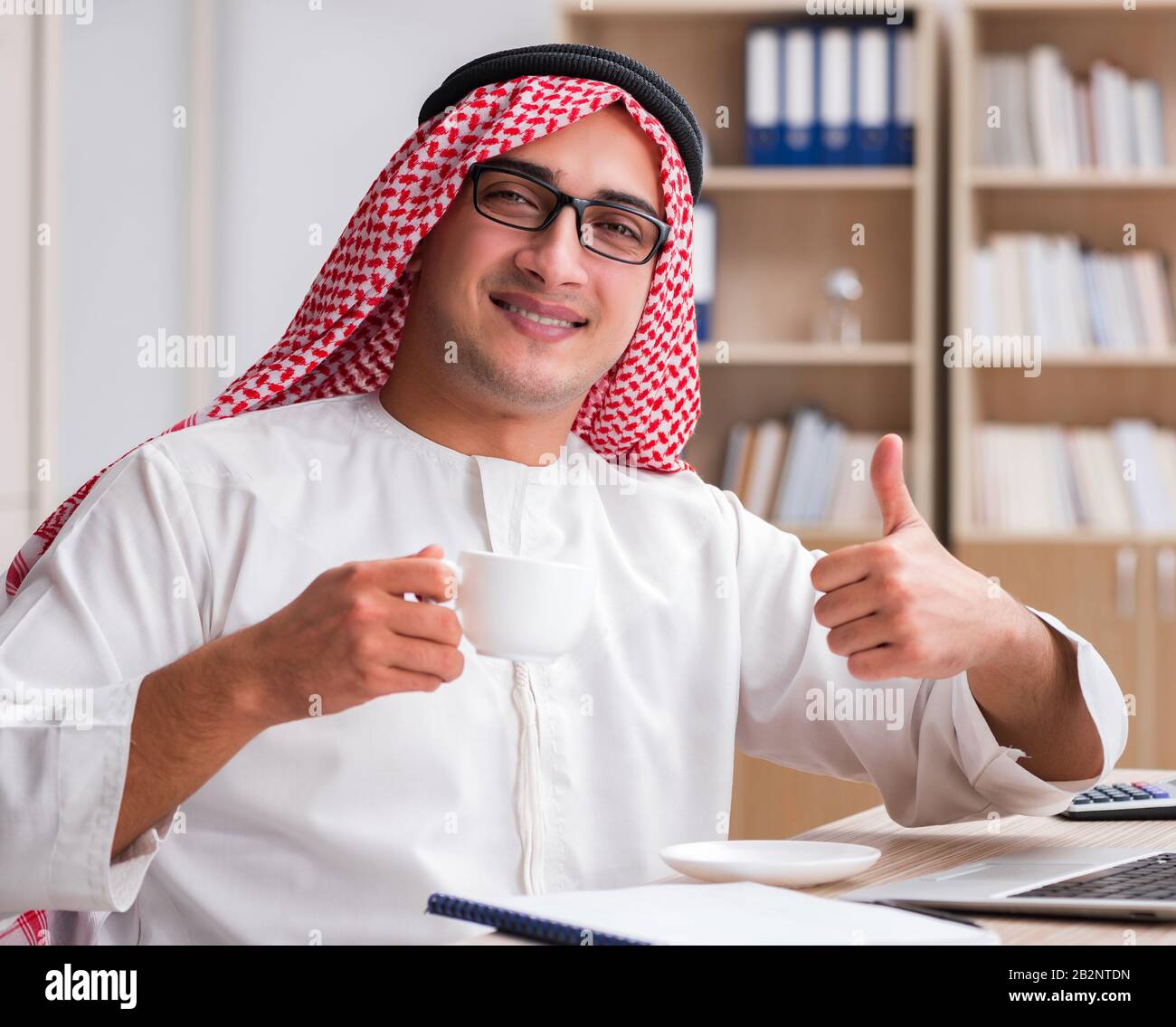 The arab businessman working in the office Stock Photo - Alamy