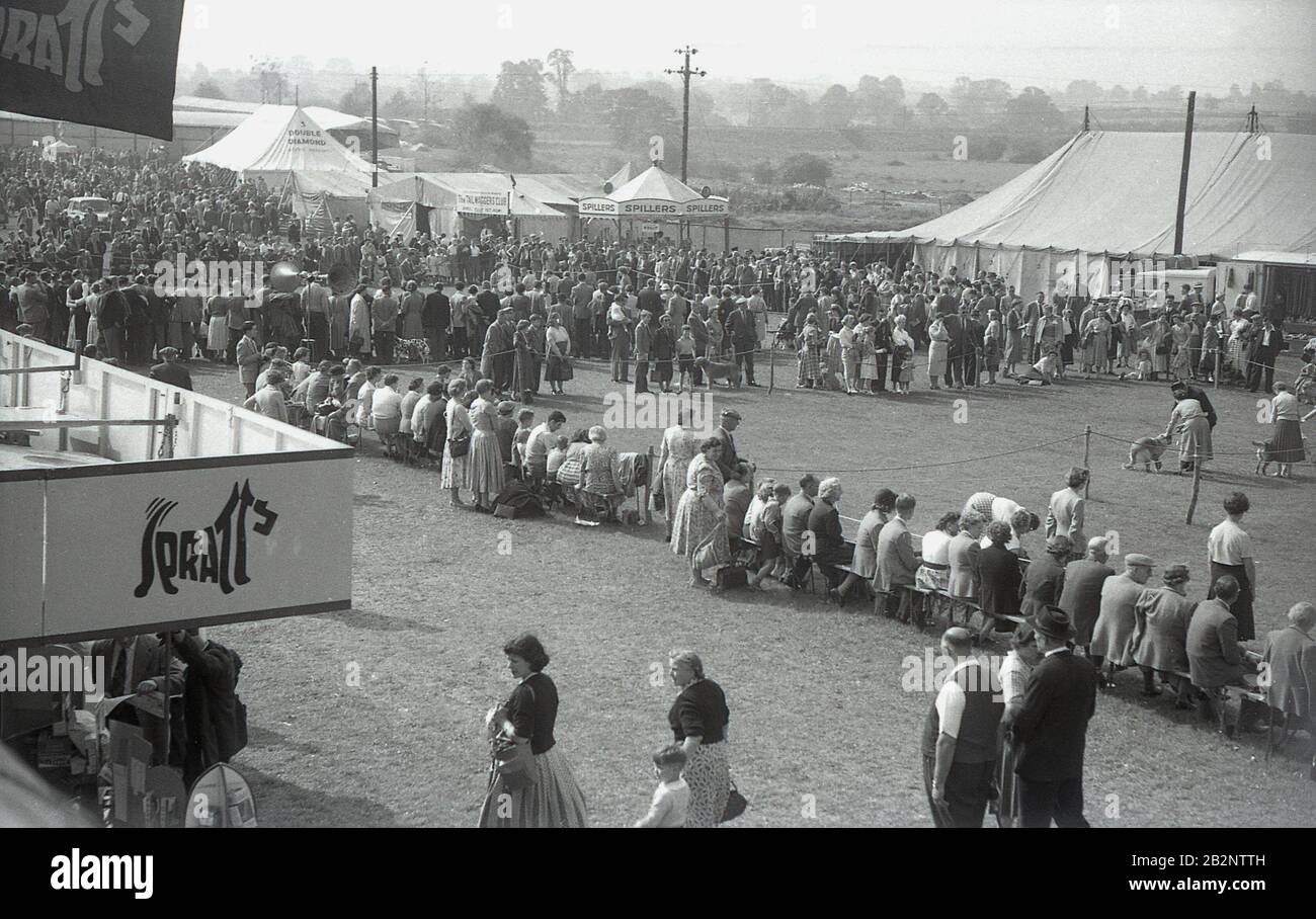 1950s, historical, spectators watching a dog show outside the tented village at the Thame Show, Oxfordshire, England, UK Stock Photo