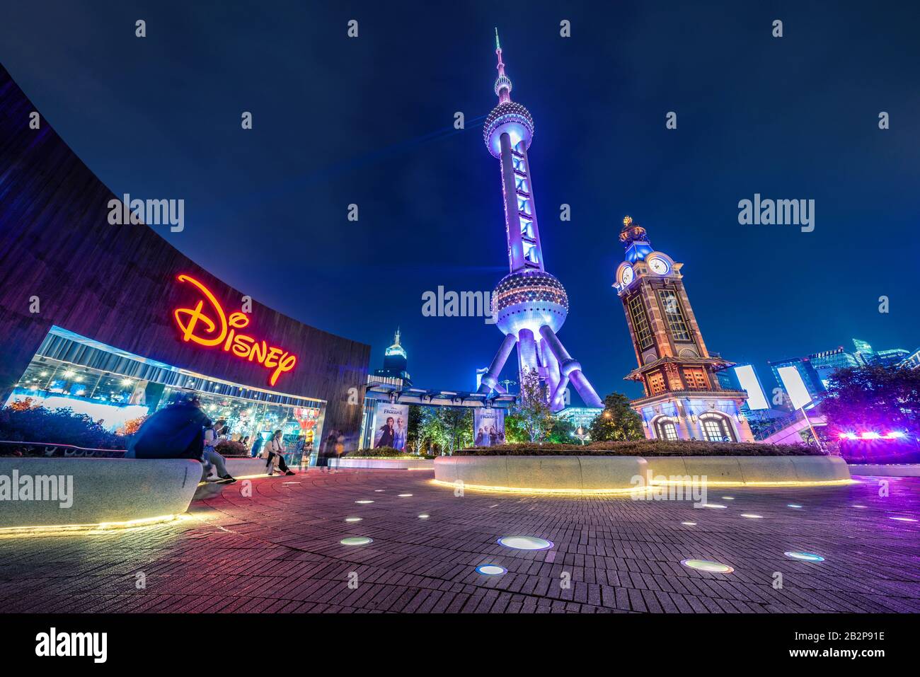 SHANGHAI, CHINA, OCTOBER 30: Night view of the Disney store with the Oriental Pearl Tower in the Lujiazui financial district on October 30, 2019 in Sh Stock Photo
