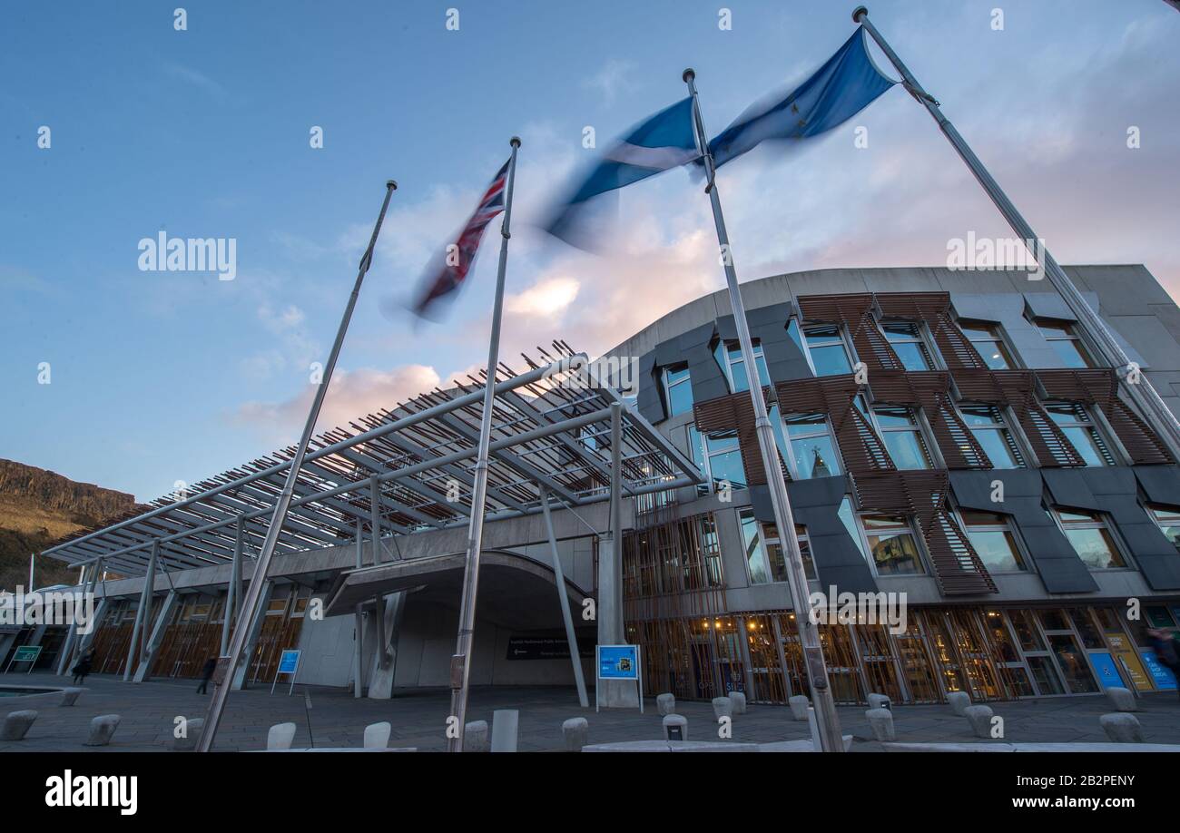 Edinburgh, UK. 3rd Mar, 2020. Pictured: Flags outside the Scottish Parliament blow in the wind. Left to right is the Union Jack; Saltire (St Andrews Cross); The Flag of Europe. The Scottish Parliament voted in favour to leave the EU Flag flying outside of Parliament after the UK left the EU on the 31st January 2020. Scotland voted in a. majority to remain in the EU despite the rest of the UK voting to leave the EU. The Scottish Government are looking at ways to rejoin the EU. Credit: Colin Fisher/Alamy Live News Stock Photo