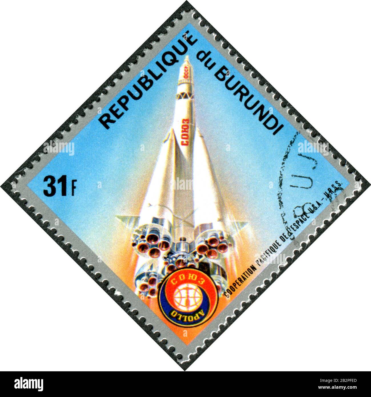 BURUNDI - CIRCA 1975: A stamp printed in Burundi, dedicated Apollo – Soyuz Test Project, depicted Soyuz launch, circa 1975 Stock Photo