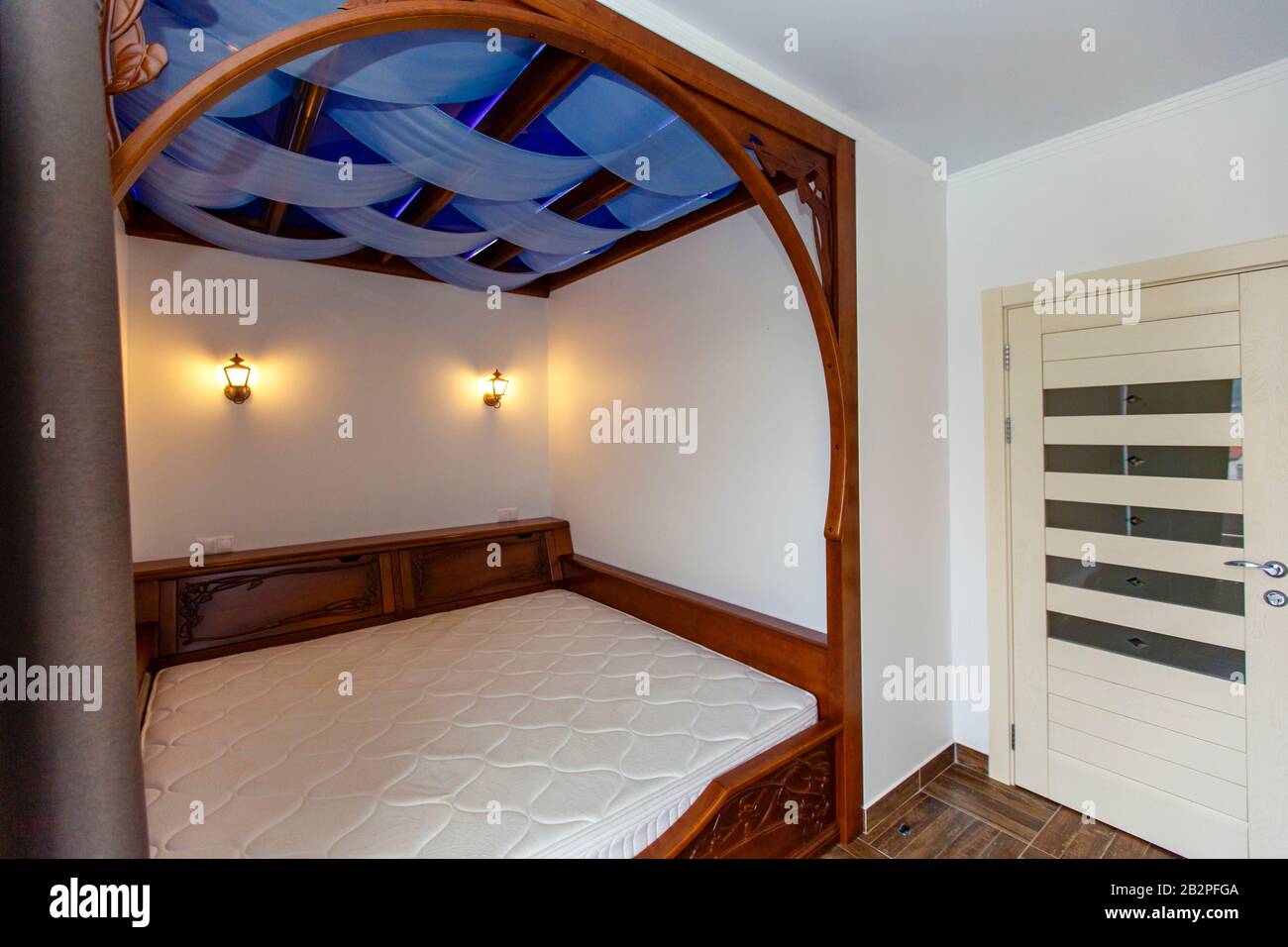 Bedroom In The Cottage With A Large Wooden Four Poster Bed The