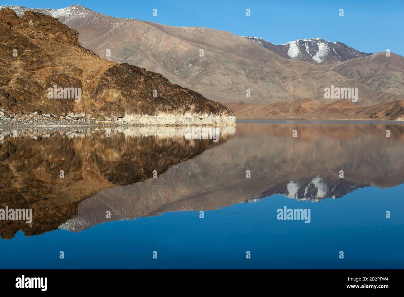 Mirror reflection in calm lake. morning light. Western Mongolia Stock Photo
