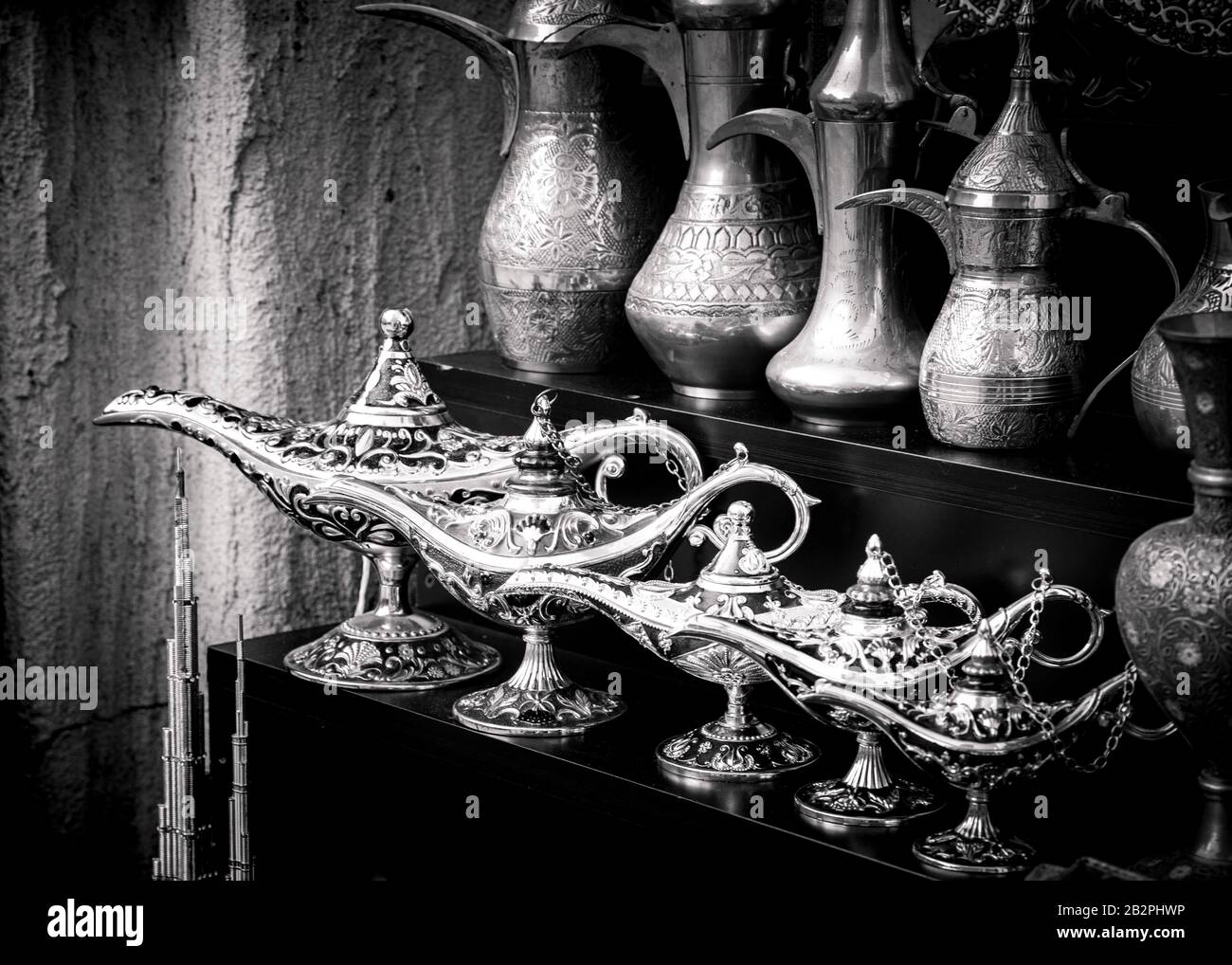 Black and white close up of magic lamps and tradition Arabian style coffee pots. Stock Photo