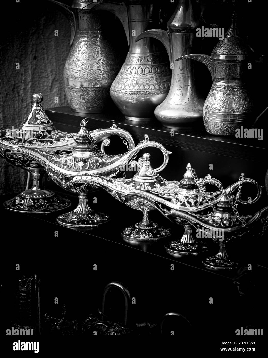 Black and white close up of magic lamps and traditional Arabian style coffee pots. Stock Photo