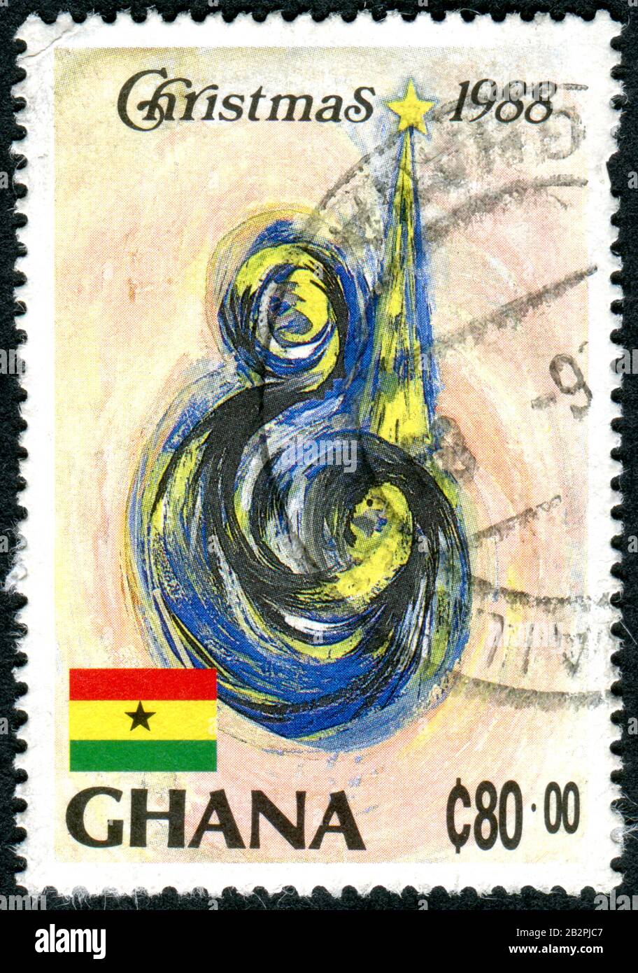 GHANA - CIRCA 1988: A stamp printed in Ghana, Christmas issue, depicted the Mother, Child, Tree, circa 1988 Stock Photo