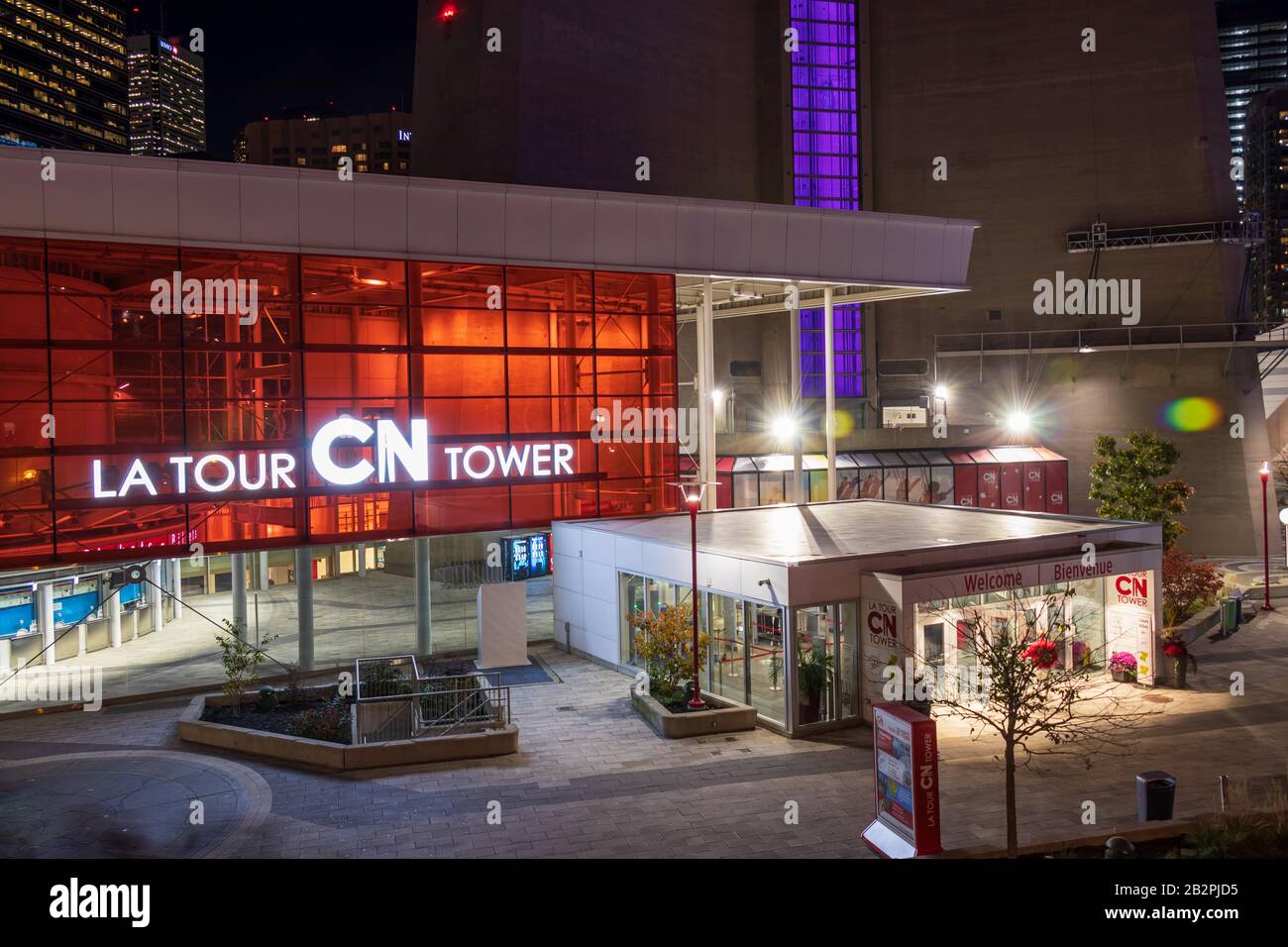 Base of the CN Tower building lit up late at night on quite evening in downtown Toronto. Stock Photo