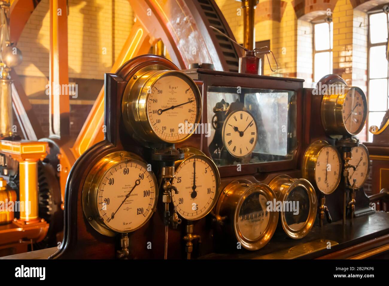 Measurement gauges and large flywheel at Abbey Pumping Station, a museum of science and technology in Leicester, England Stock Photo