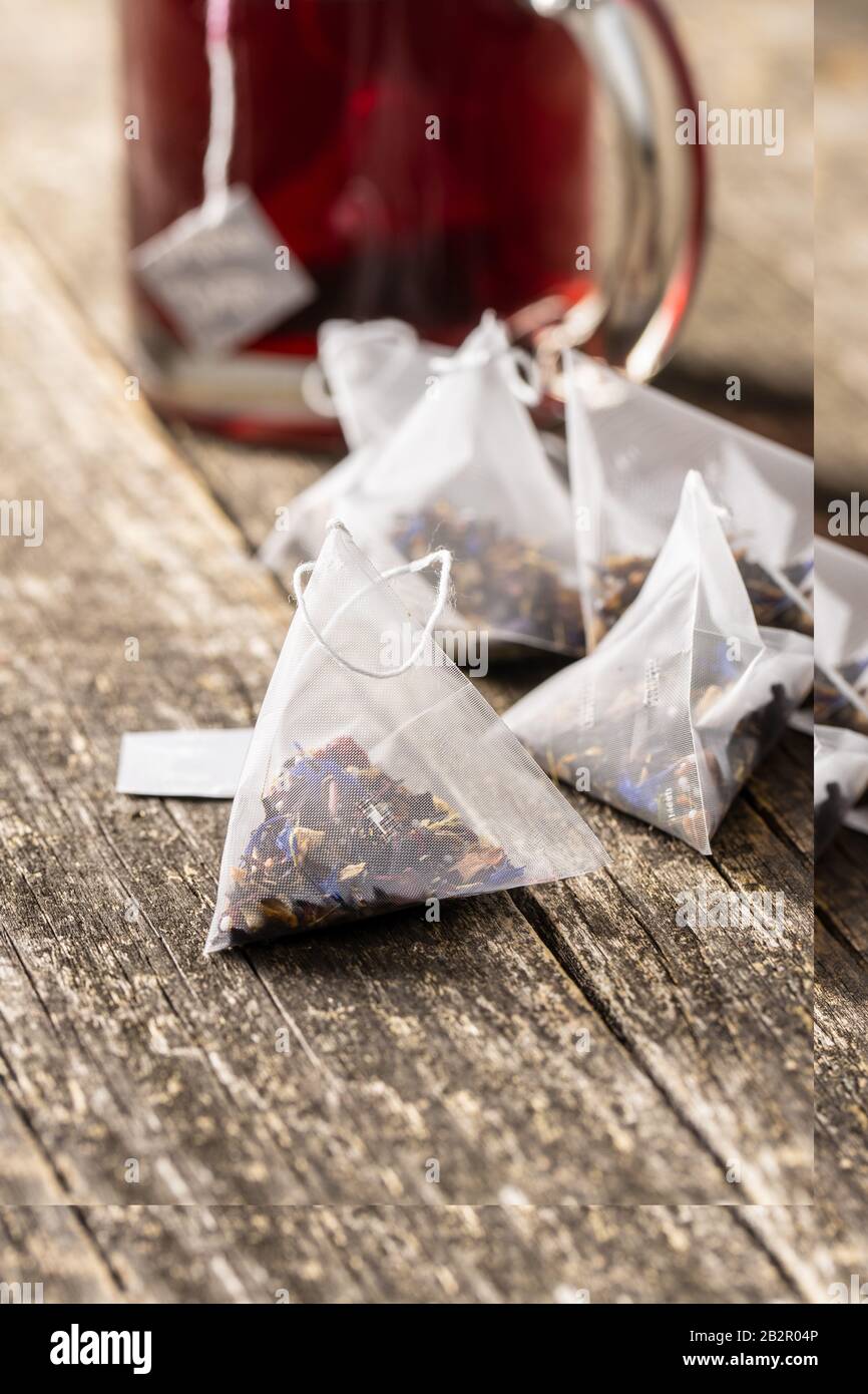 Floral tea bag on old wooden table. Stock Photo