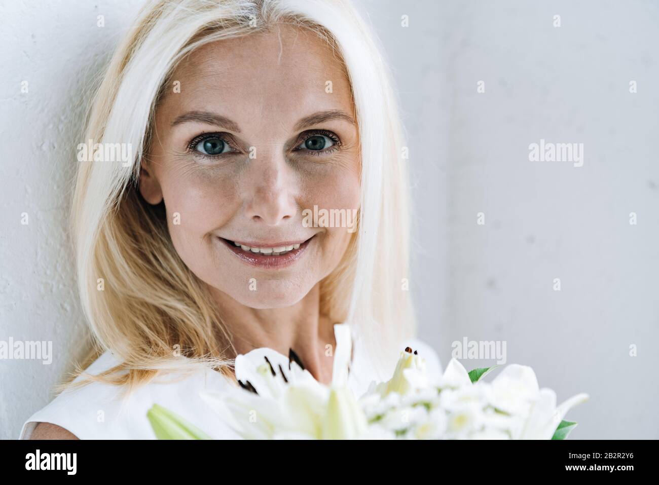 Happy blonde mature woman hi-res stock photography and images - Alamy