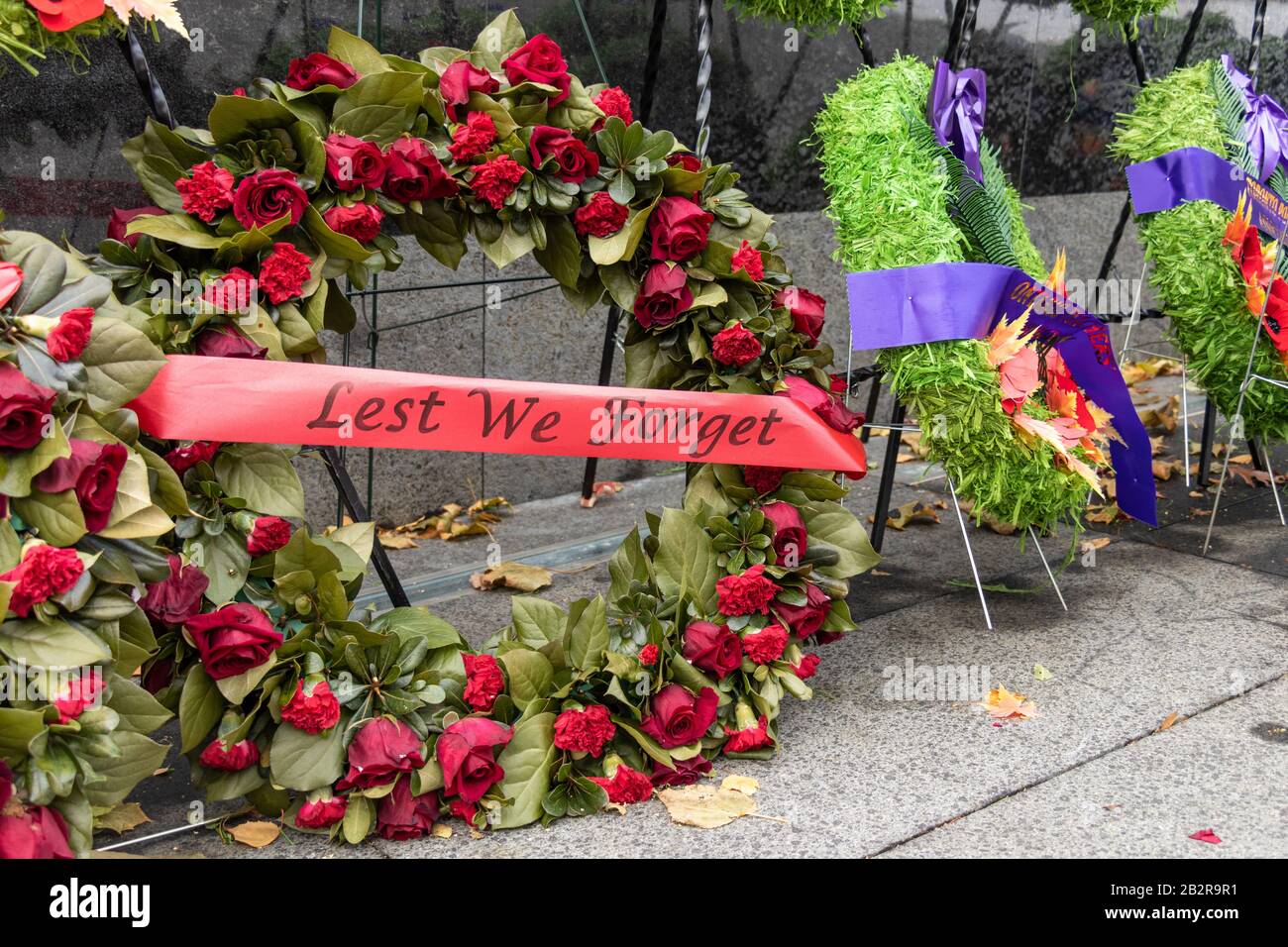 Wreath with 'Lest We Forget' ribbon, laid at the Ontario Veterans War Memorial at Queen's Park for Remembrance Day. Stock Photo