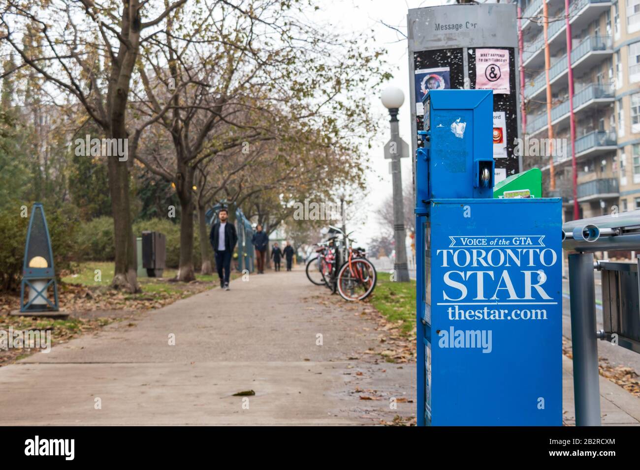 A Toronto Star newspaper rack on a busy sidewalk in downtown Toronto. Stock Photo