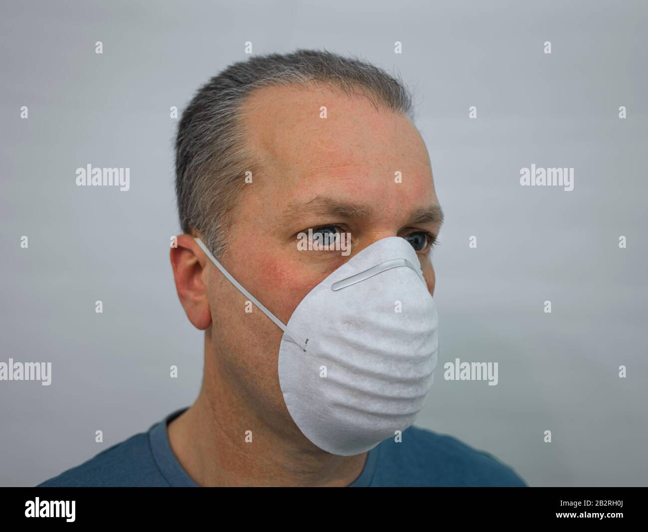 The face of a man wearing a breathing mask Stock Photo