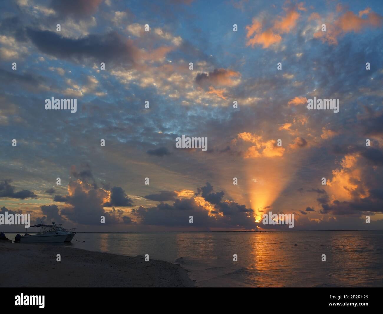French Polynesia - Tikehau Atoll: Sunset with boat Stock Photo