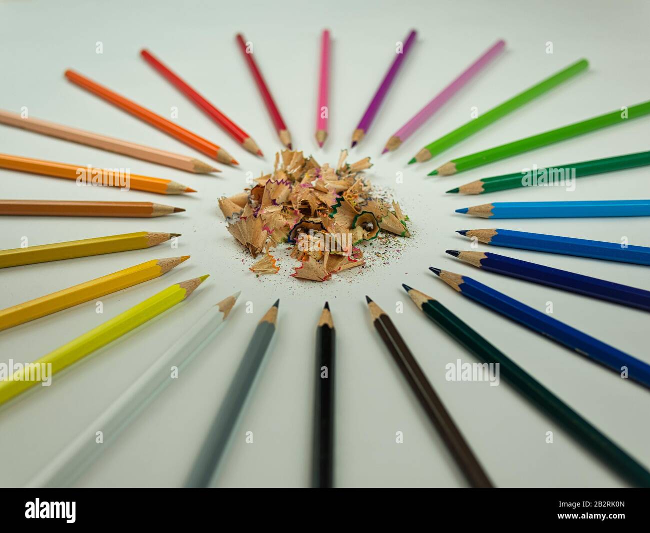 A circle of sharpened crayons in different colours Stock Photo
