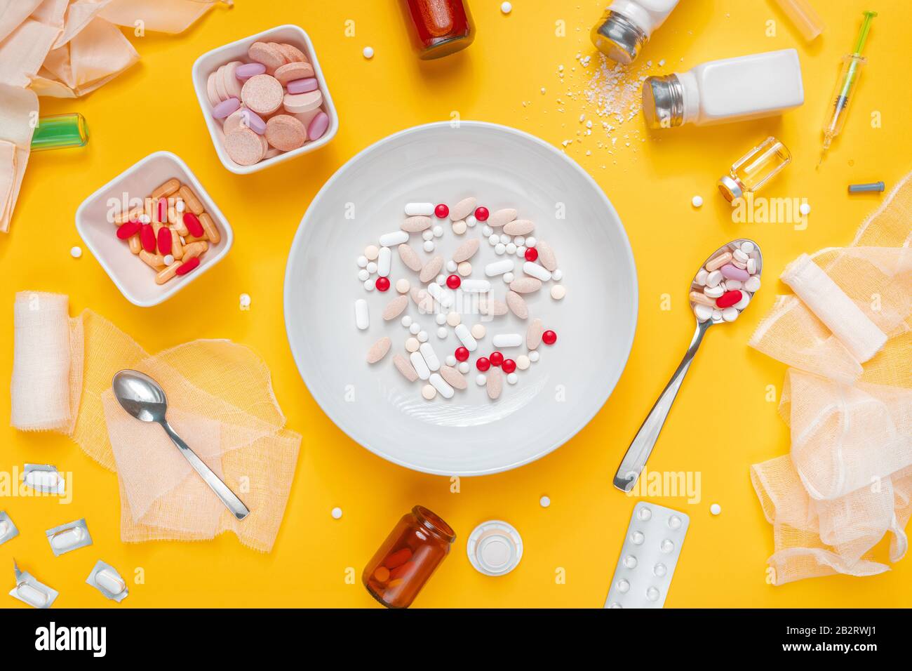 Drug abuse and medical overuse concept, top view flat lay plate with medicine tablets and pills Stock Photo