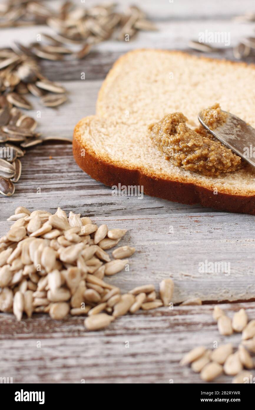 Hulled sunflower seeds, whole sunflower seeds and sunflower butter on