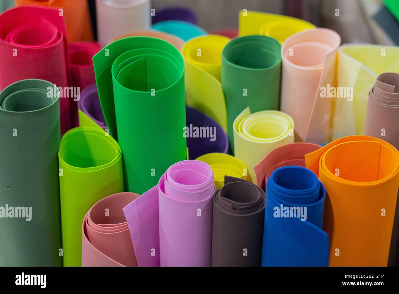 Multicolored wrapping paper on the shop counter. Presents Stock Photo