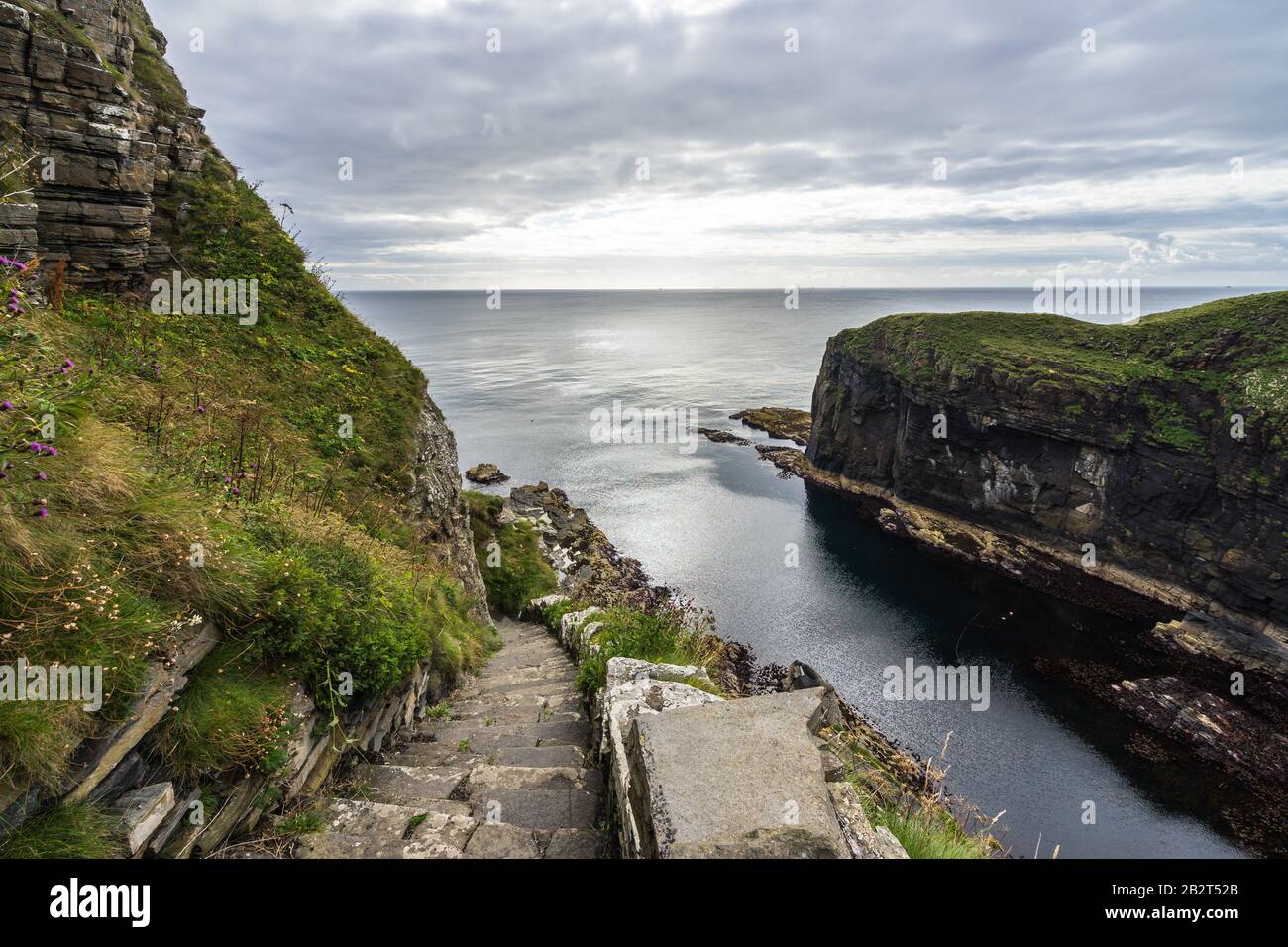 Famous Whaligoe Steps, a man-made stairway of 365 steps near Wick, Caithness, Scotland Stock Photo