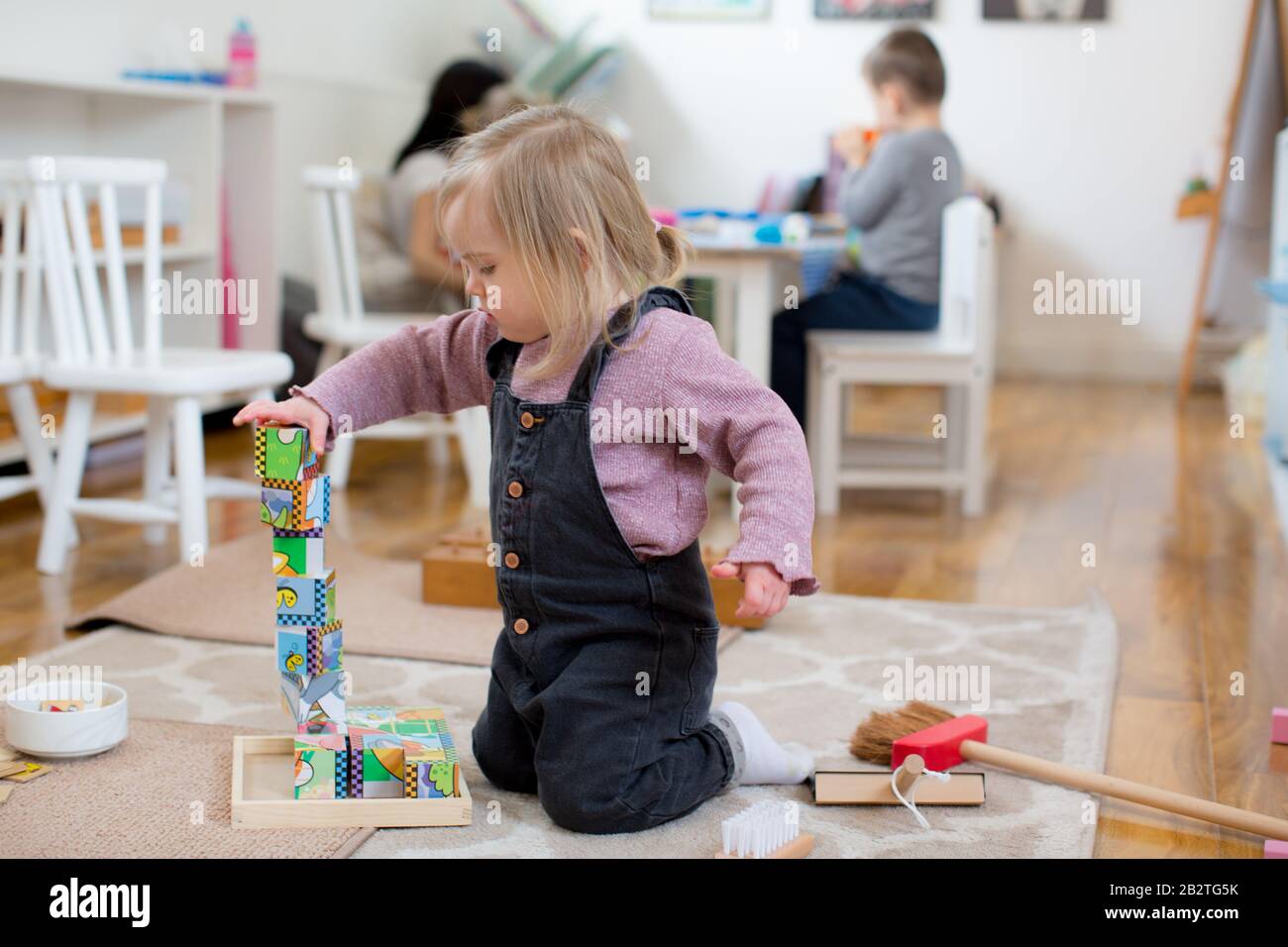 1 year old building a tower Stock Photo