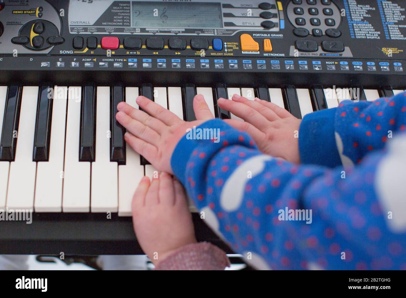 Children playing the keyboard Stock Photo