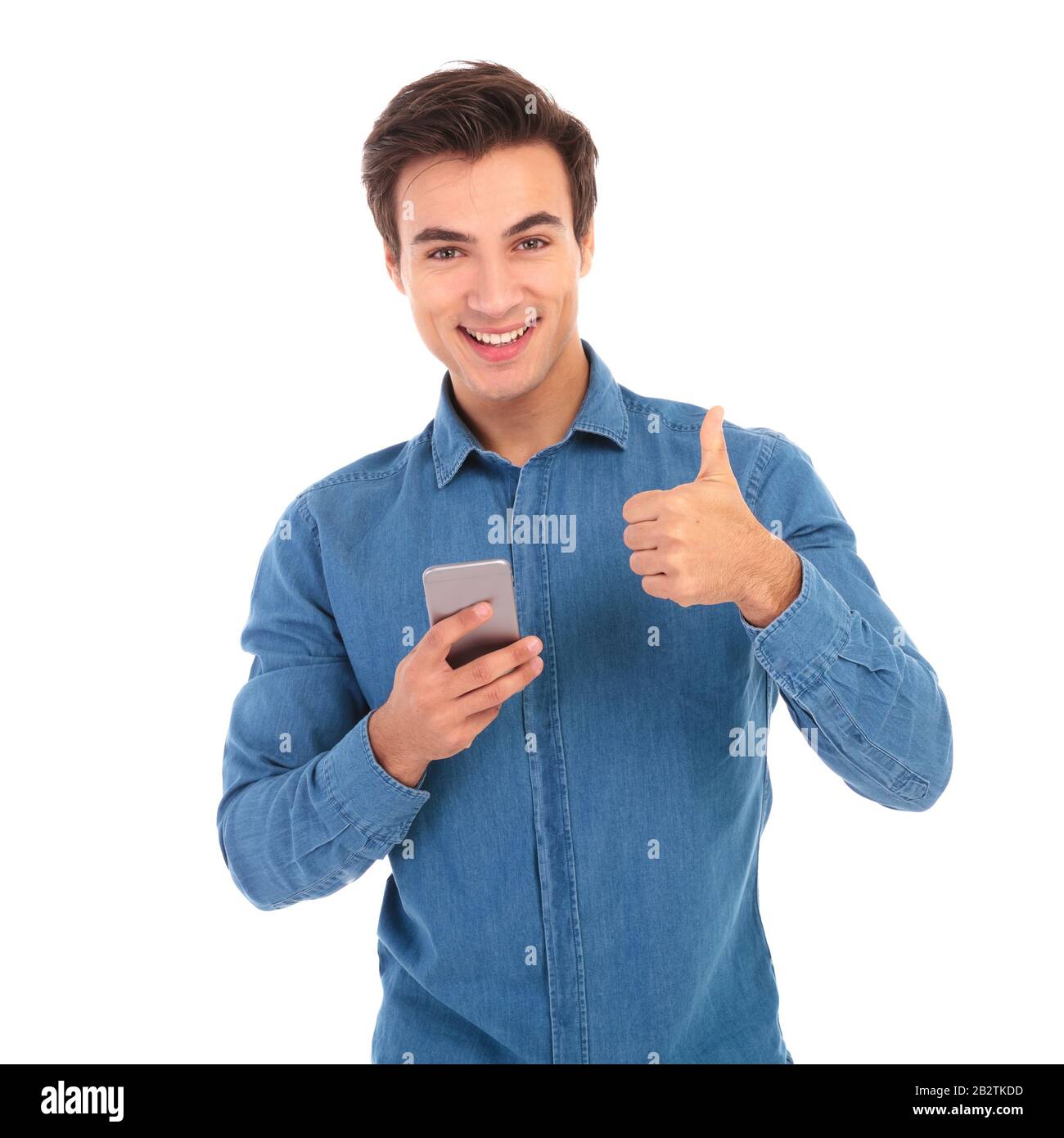 happy casual man reading messages on phone and makes ok hand sign on ...