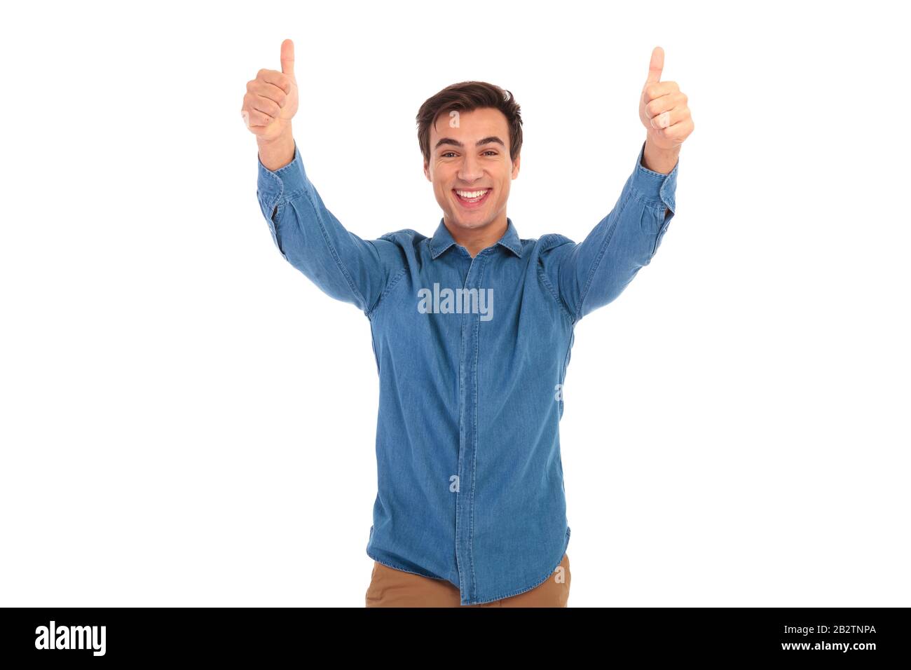 excited young casual man making the ok thumbs up hand sign on white ...