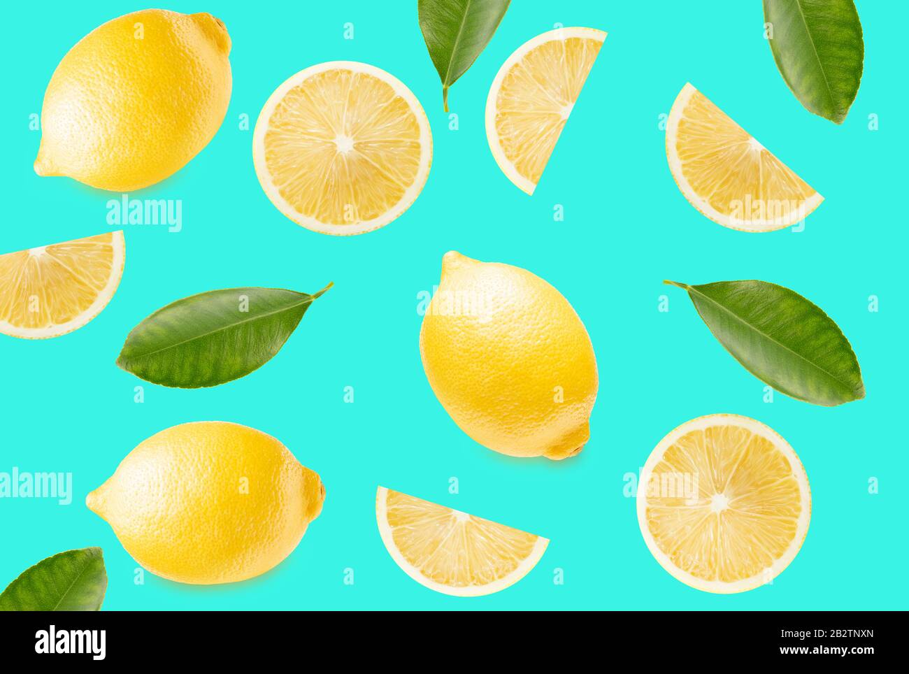pattern with lemon slices and leaves on a light blue background. Stock Photo