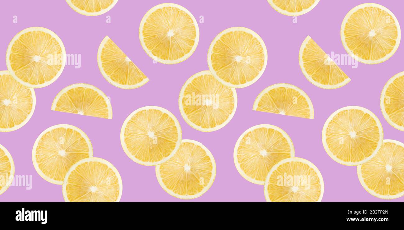 pattern with lemon slices on a purple background. Stock Photo