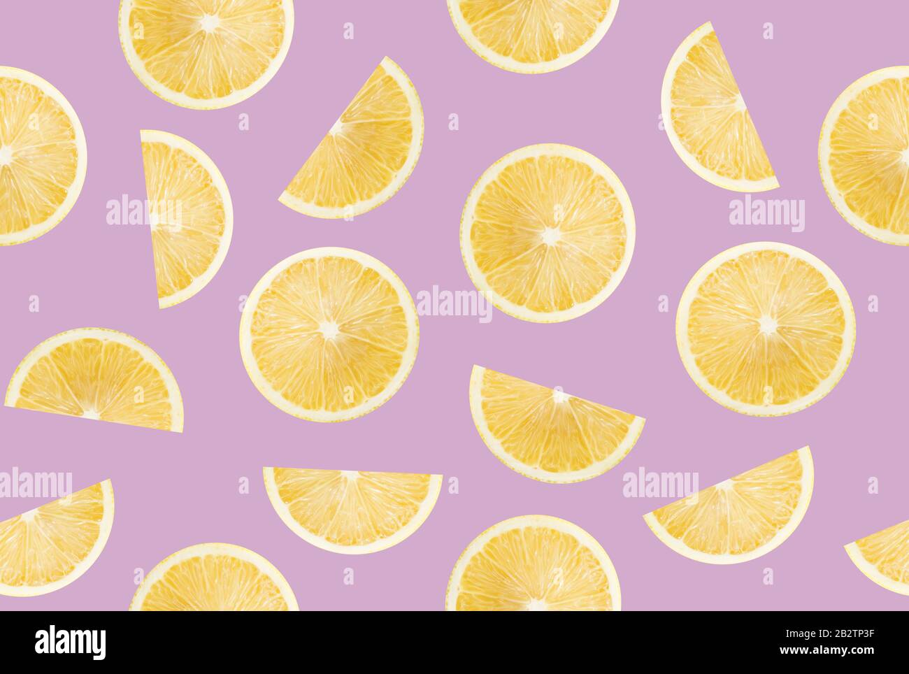 pattern with lemon slices on a purple background. Stock Photo