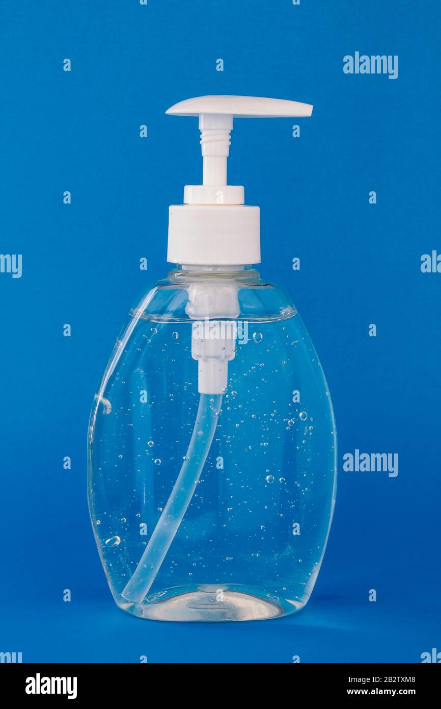 Hand sanitizer isolated on a blue background Stock Photo