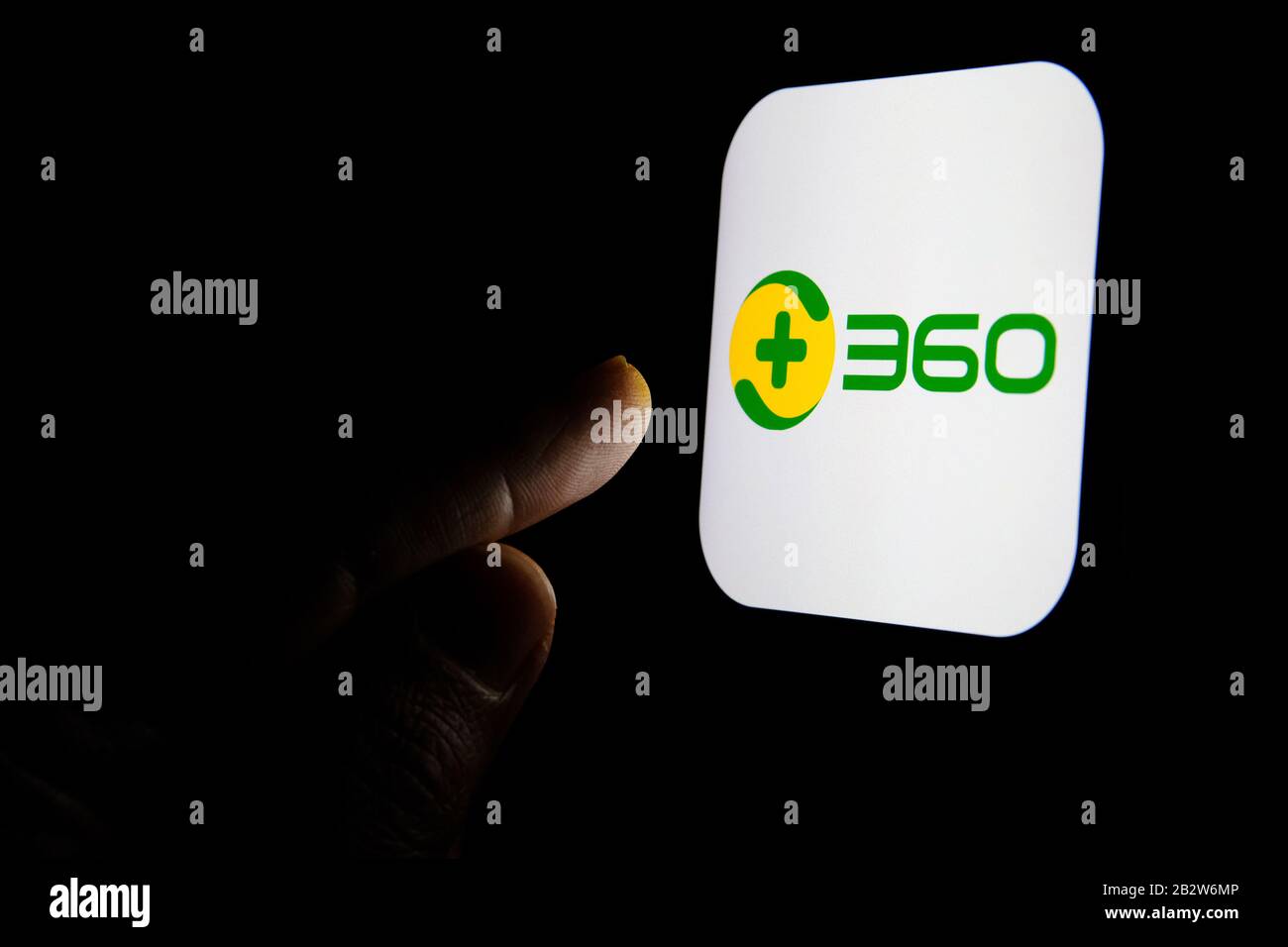 Qihoo 360 Chinese antivirus firm logo on the glowing smartphone screen and  finger points on it. Concept Stock Photo - Alamy