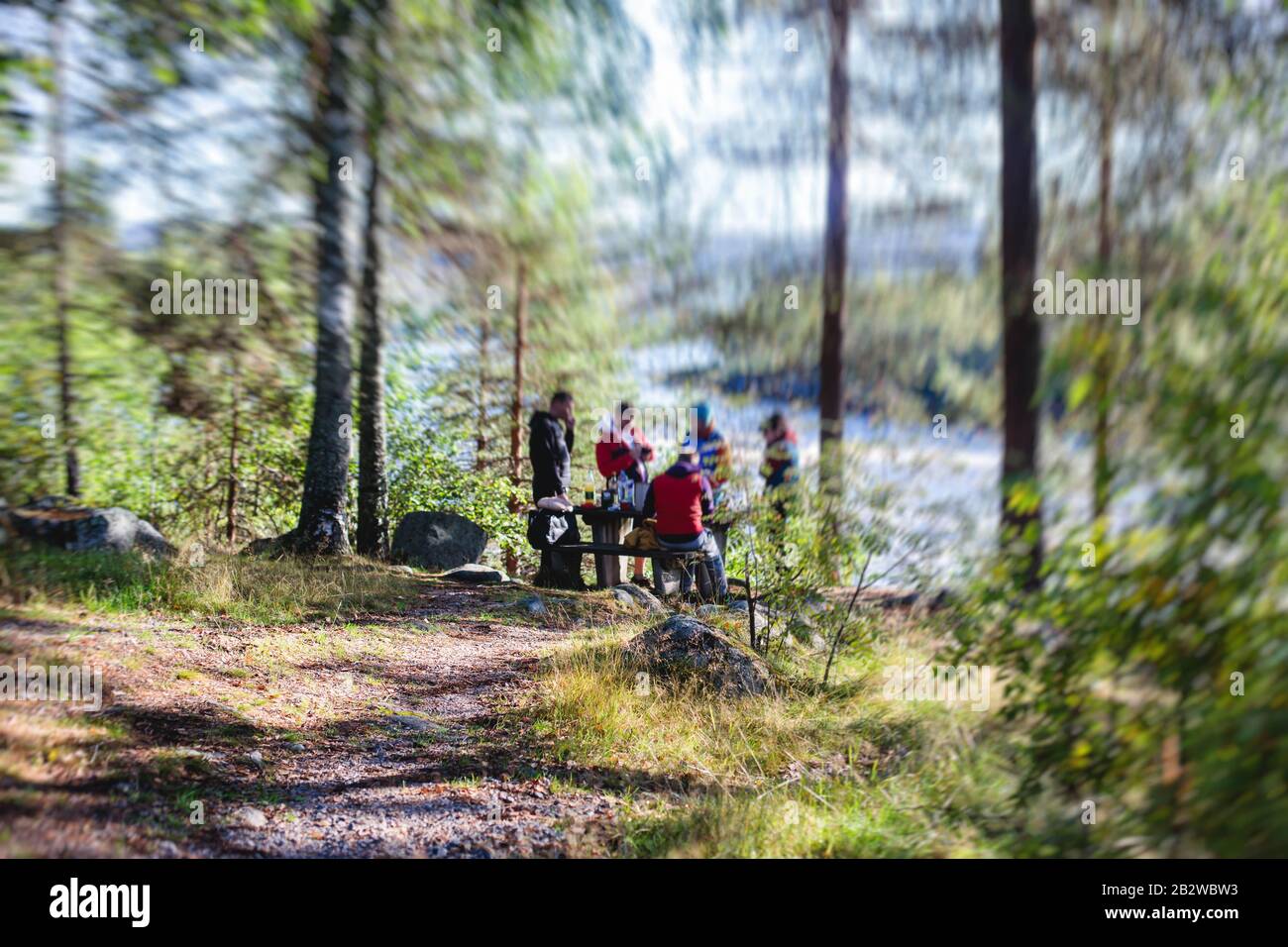 View of Kalix river, Kalixalven, Overkalix locality and the seat in Norrbotten county, Sweden, with forest in sunny summer day, aerial drone view Stock Photo